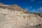 Tourists sitting on the rock formations known as the Hoodoos on a sunny