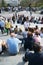 Tourists sitting on stairs near Sacre-Coeur Paris