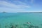 Tourists snorkel in crystal turquoise water near tropical resort in Phuket, Thailand. Summer, Vacation, Travel and Holiday concept