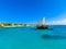 Tourists snorkeling along the coastline and enjoy the tropical island of Aruba