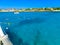 Tourists snorkeling along the coastline and enjoy the tropical island of Aruba