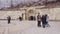 Tourists on the square in front of the entrance to the underground hydrogen sulphide lake Proval