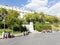 Tourists on the square near the statue of Goya in Madrid