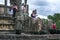 Tourists stand on the stairway of the Vatadage which forms part of the Quadrangle at the ancient Sri Lankan capital at