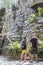 Tourists standing at the aviary with mountain goats