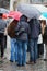 Tourists standing in the rain