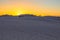 Tourists Standing On Sand Dune Watching A Desert Sunset