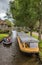 Tourists steering a boat through the canals of Giethoorn