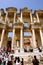 Tourists on the steps of the ruins of the ancient Roman library