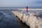 Tourists stroll along the coast of the Gulf of Finland. Sunny, fine day after a hurricane and an ice storm