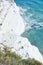 Tourists stroll and sunbathe at the `Scala dei Turchi` scale of the Turks