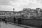 Tourists strolling along the Arno River and View of the crowded Ponte Vecchio on a Beautiful Sunny Spring Day in Florence, Italy