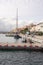 Tourists strolling along the picturesque promenade in the port of the Frioul Islands in Marseille