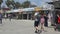 Tourists strolling along the world famous Venice Beach Boardwalk in Southern California