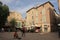 Tourists strolling in the central square of the french city of Pezenas, France