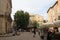 Tourists strolling in the central square of the french city of Pezenas, France