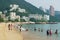 Tourists sunbathe at the Stanley town beach in Hong Kong, China. .