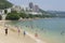Tourists sunbathe at the Stanley town beach in Hong Kong, China.