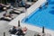 Tourists sunbathe in the swimming pool at their hotel in El Arenal beach in Mallorca