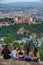 Tourists at sunset over Granada and Alhambra