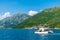 tourists swim in the Boka Kotorska Bay on a motor catamaran.