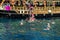 Tourists swim in turquoise water in the Mediterranean Sea next to a pirate ship in Alanya.