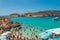 Tourists  swimming at Blue Lagoon, Comino, Malta