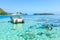 The Tourists swimming and feeding sharks and Stingrays in beautiful sea at Moorae Island, Tahiti PAPEETE, FRENCH POLYNESIA