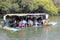 Tourists take the bamboo raft to visit