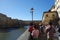 Tourists take a photo close Ponte Vecchio in Florence