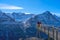 Tourists take photos on the Cliff Walk, a popular viewing platform on the First mountain in Grindelwald, which offers with  Alpin