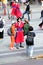 Tourists take photos with korean woman wearing traditional clothes at n seoul tower in Seoul City