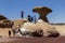 Tourists take photos at Mushroom Rock in Wadi Rum in Jordan.