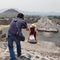 Tourists take a picture from the pyramid of the sun