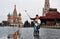 Tourists take pictures with mobile phone on the Red Square in Moscow.