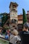 Tourists take pictures of a puppet show on Drunk clock tower of puppet theater in Tbilisi Georgia