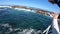 Tourists taking photo of seal island near Cape Town South Africa boat trip