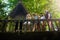 Tourists taking photos on ancient jungle ruins in thailand