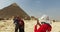 Tourists taking photos in front of Pyramid of Khafre