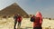 Tourists taking photos in front of Pyramid of Khafre