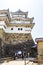 Tourists taking photos of an inner gate from Himeji castle