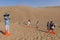 Tourists taking pictures in the dunes around the city of Dunhuang, in the ancient Silk Road, in China.