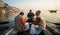 Tourists taking the popular boat tour on the sacred Ganges river in Varanasi, Utta