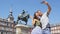 Tourists taking selfie using smart phone in Madrid Spain on Plaza Mayor