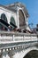 Tourists talk to each other on the Rialto Bridge, Grand Canal