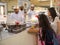 Tourists talk to Omani sellers at the Friday souk in Nizwa