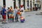 Tourists talking to Cubans in street