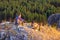 Tourists on top of a rocky hill.