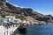 Tourists and tourist ship in the old port in Fira, Santorini