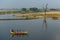 Tourists on traditional boat near U Bein Bridge, Myanmar